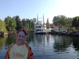 Click to enlarge image On the mighty Mississippi River. The steamboat Mark Twain and Thunder Mountain in the background - Flat Tigger Goes to Disneyland - The continuing story of Ray's Flat Tigger