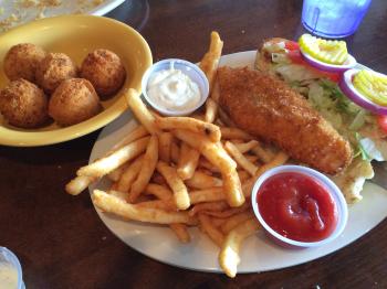 Click to enlarge image Gulf Fish Po Boy with Hushpuppies! - Fins Grill and Icehouse in Port Aransas, Texas! - Great restaurant right on the harbor, a fun and delish place to eat!!