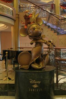 Click to enlarge image Tigger, feeling a bit anxious over his time with Minnie, busies himself inspecting her feathers! - Minnie Mouse is one of Tigger's FAVORITE Disney Characters! - A Cruise on the Disney Fantasy will bring any fan closer to this wonderful Mouse.