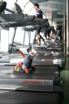 Click to enlarge image Don't get distracted by the view, though! Tigger learned that the HARD way!! - Fitness Center on Disney Cruise Line - Tigger keeps in shape at the Disney Fantasy's Senses Fitness Center
