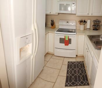 Click to enlarge image Galley kitchen has pots, pans, dishes, silverware and more available for use by any guests. - Treasure of a Condo for Rent in Destin, Florida - Tigger has his favorite Condo in Miramar Beach, Florida with a pool and only a block from a public beach!